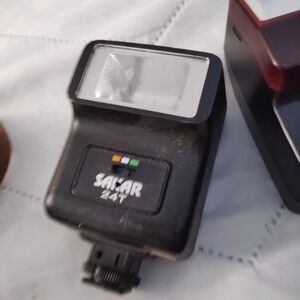 The Sak Sakar 24T Shoe-Mount Flash in Black with Green and Yellow Accents